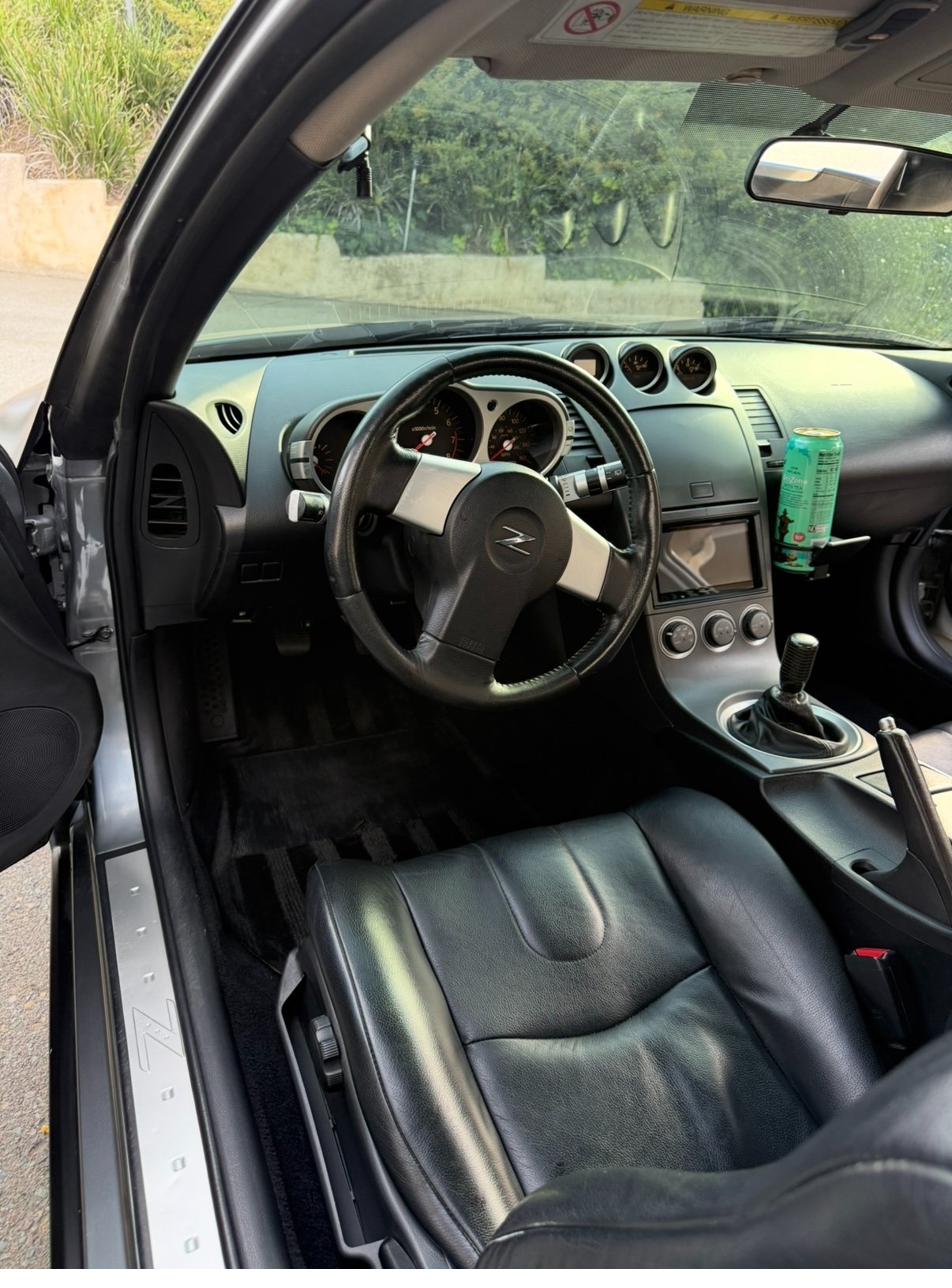 Passenger footwell after detailing — clean carpet